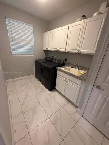 a room with a cabinets and appliances