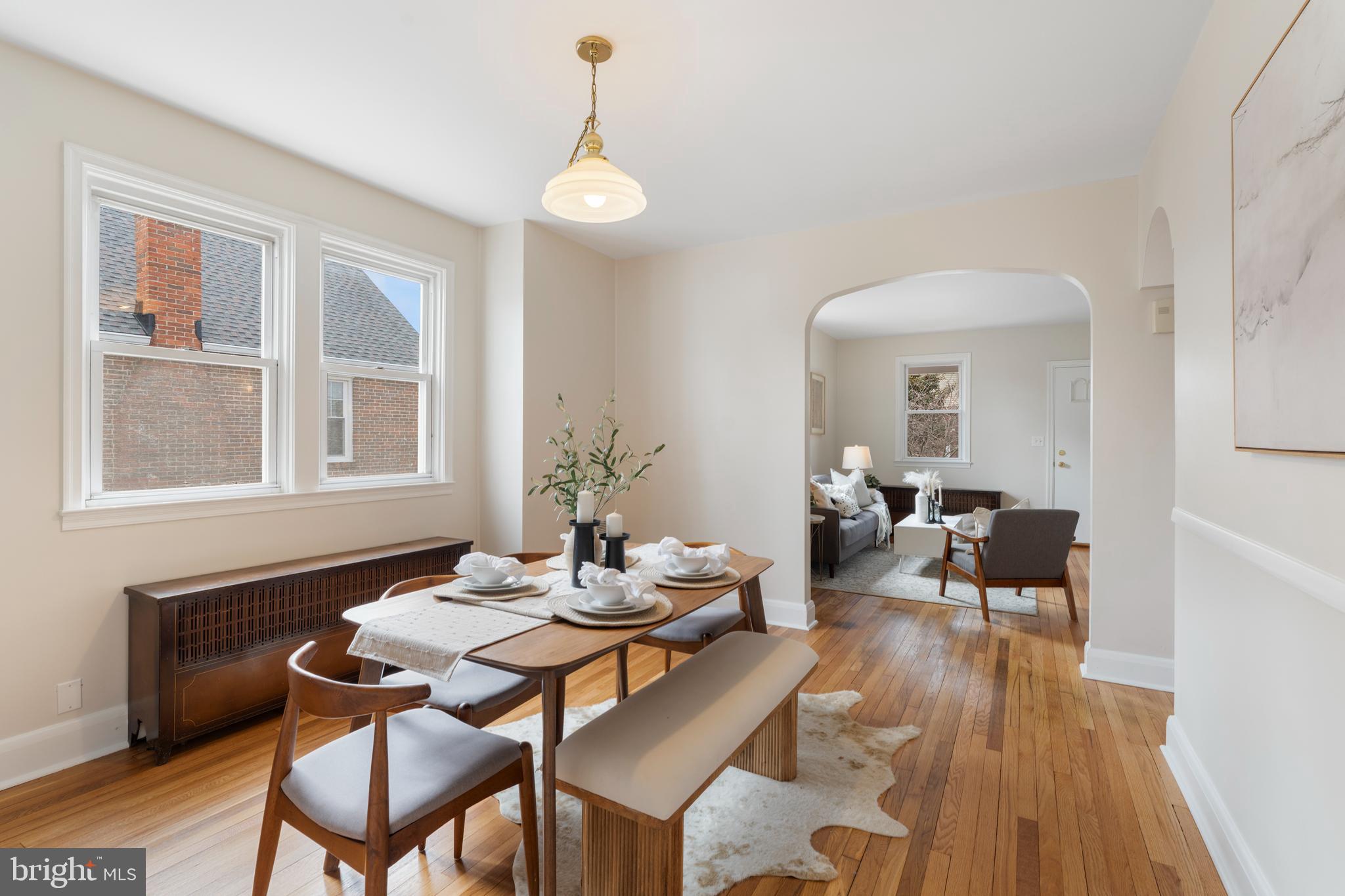 2718 Alden Road Baltimore, MD 21234 - Photo 11 of 39 a dining room with furniture a chandelier and wooden floor