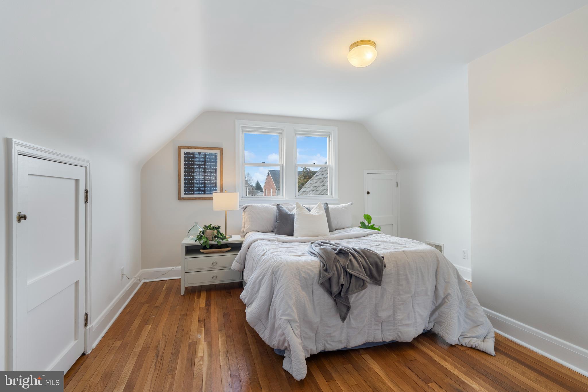 2718 Alden Road Baltimore, MD 21234 - Photo 18 of 39 a bedroom with a bed and wooden floor