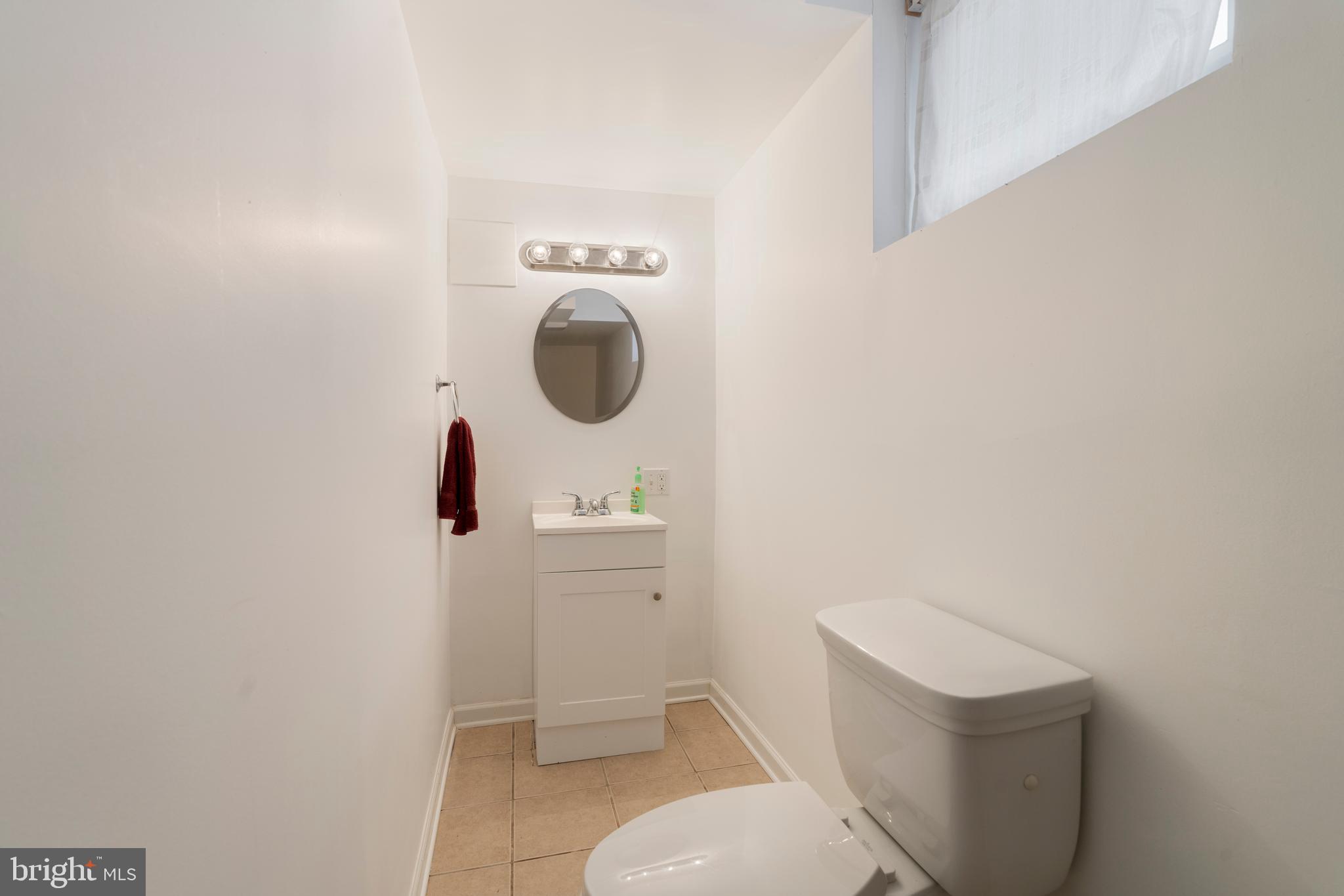 2718 Alden Road Baltimore, MD 21234 - Photo 25 of 39 a bathroom with a toilet and a sink