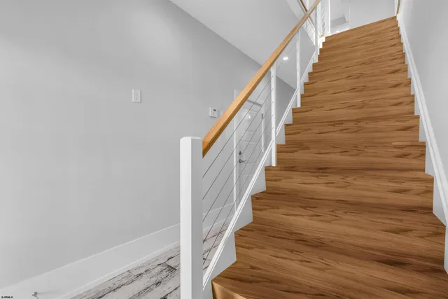 a view of entryway with wooden floor