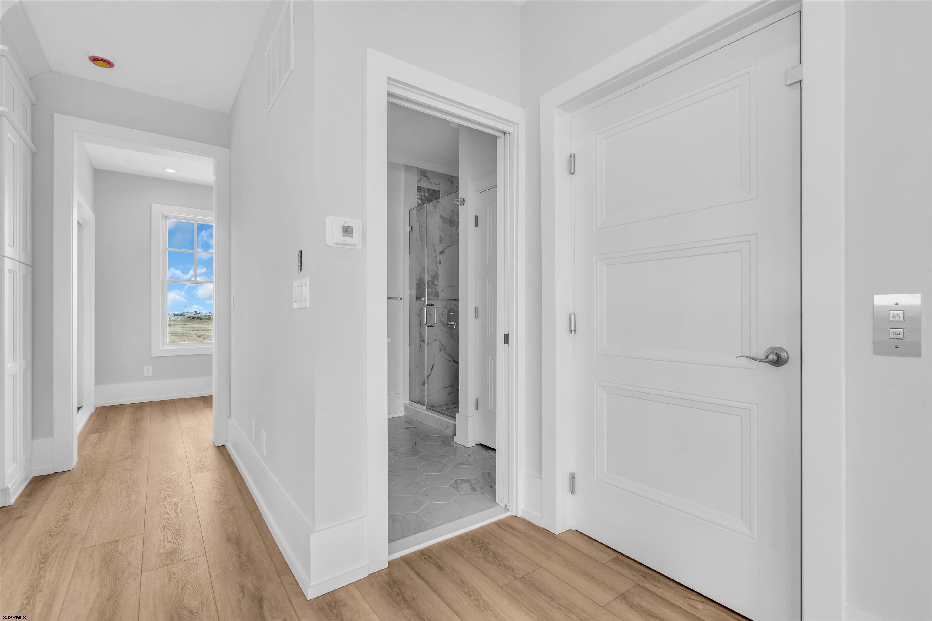 117 Taylor Avenue Strathmere, NJ 08248 - Photo 35 of 70 a view of a hallway with wooden floor