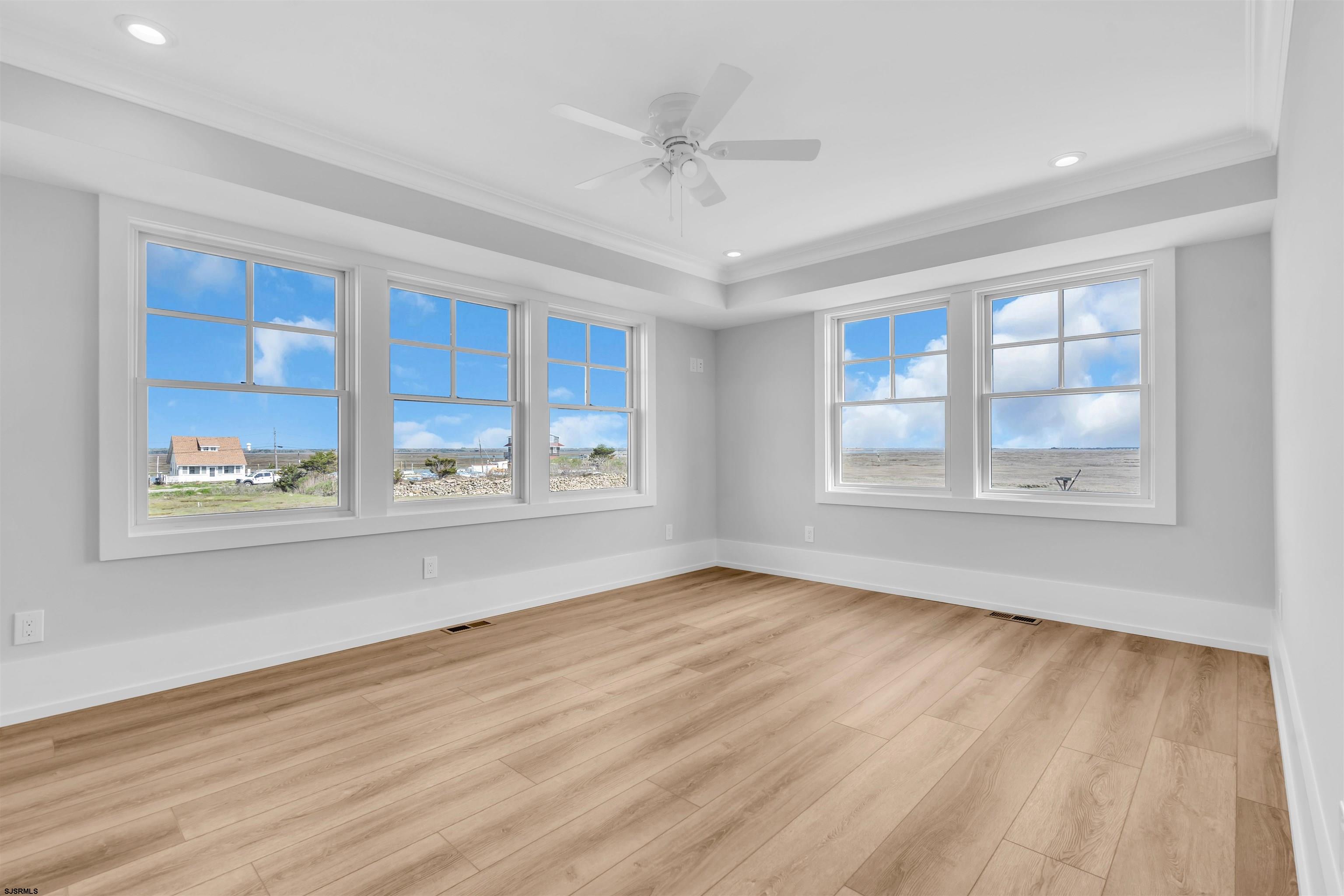 117 Taylor Avenue Strathmere, NJ 08248 - Photo 39 of 70 a view of an empty room with a window and wooden floor