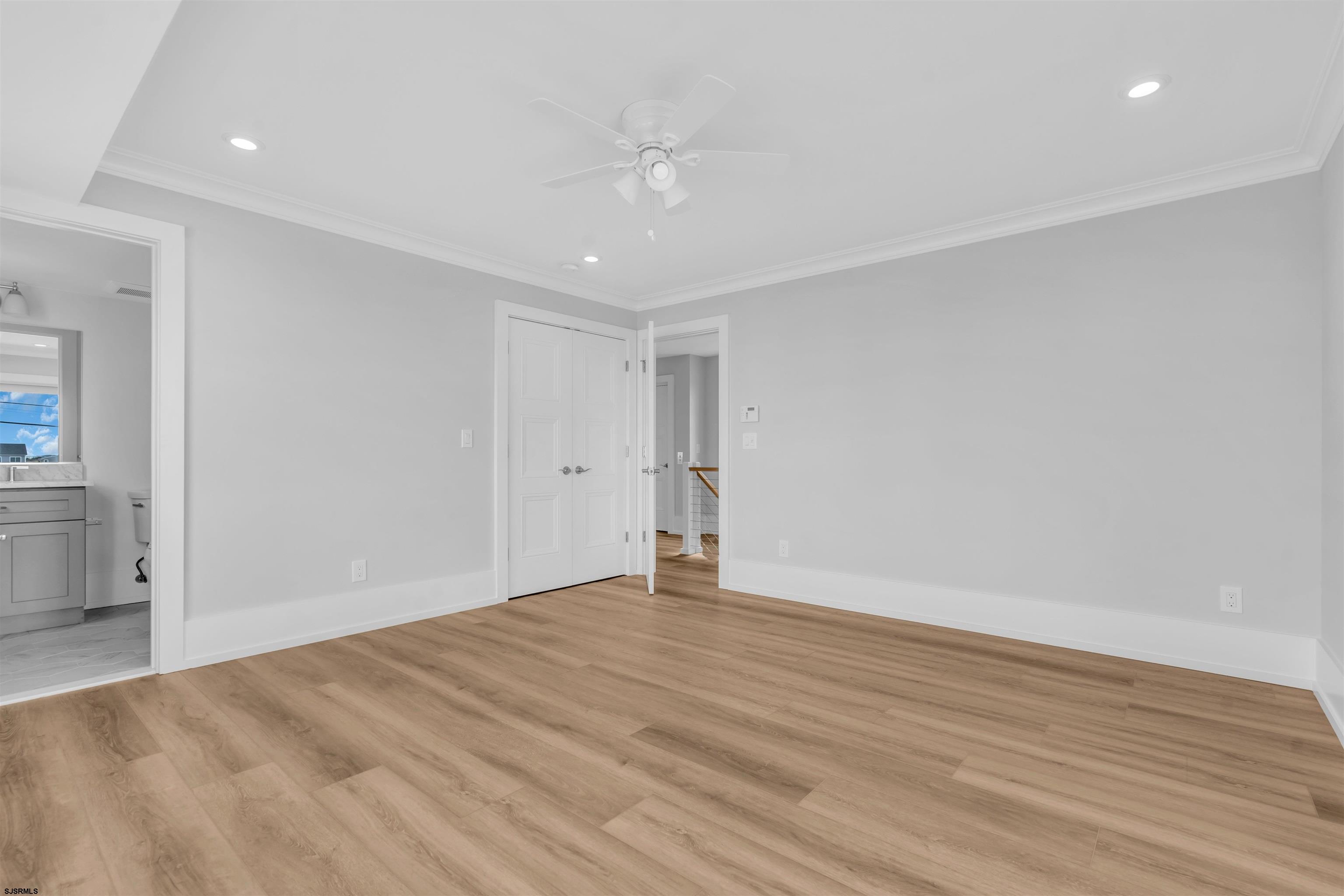 117 Taylor Avenue Strathmere, NJ 08248 - Photo 40 of 70 a view of an empty room with wooden floor