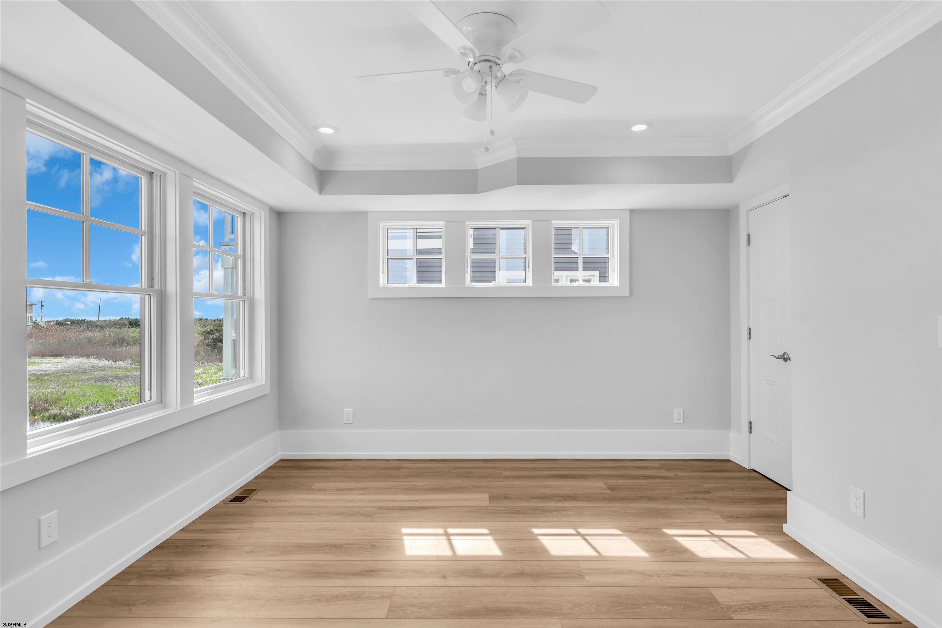117 Taylor Avenue Strathmere, NJ 08248 - Photo 42 of 70 a view of empty room with wooden floor and fan