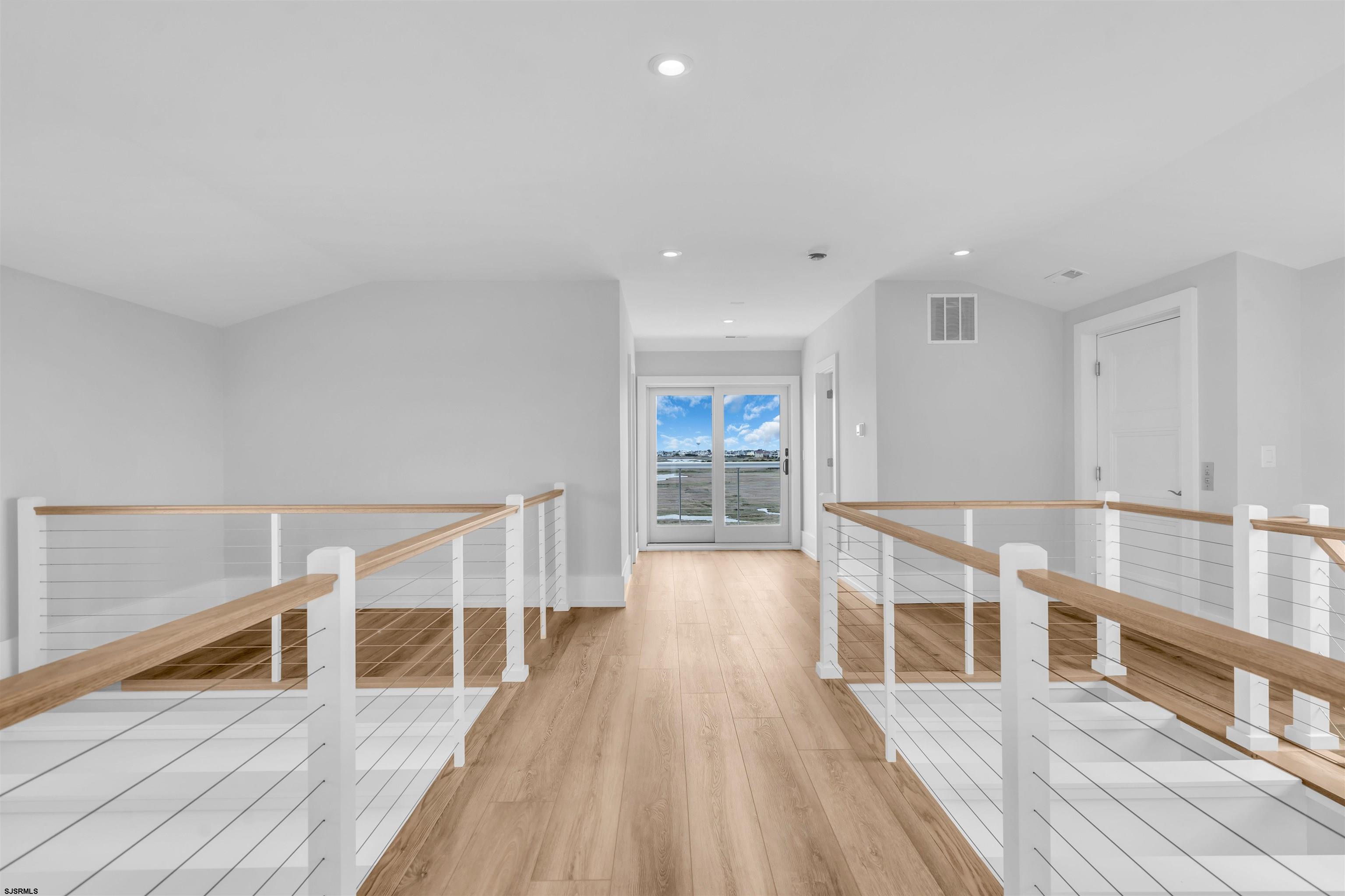 117 Taylor Avenue Strathmere, NJ 08248 - Photo 46 of 70 a view of a room with wooden floor chairs and windows