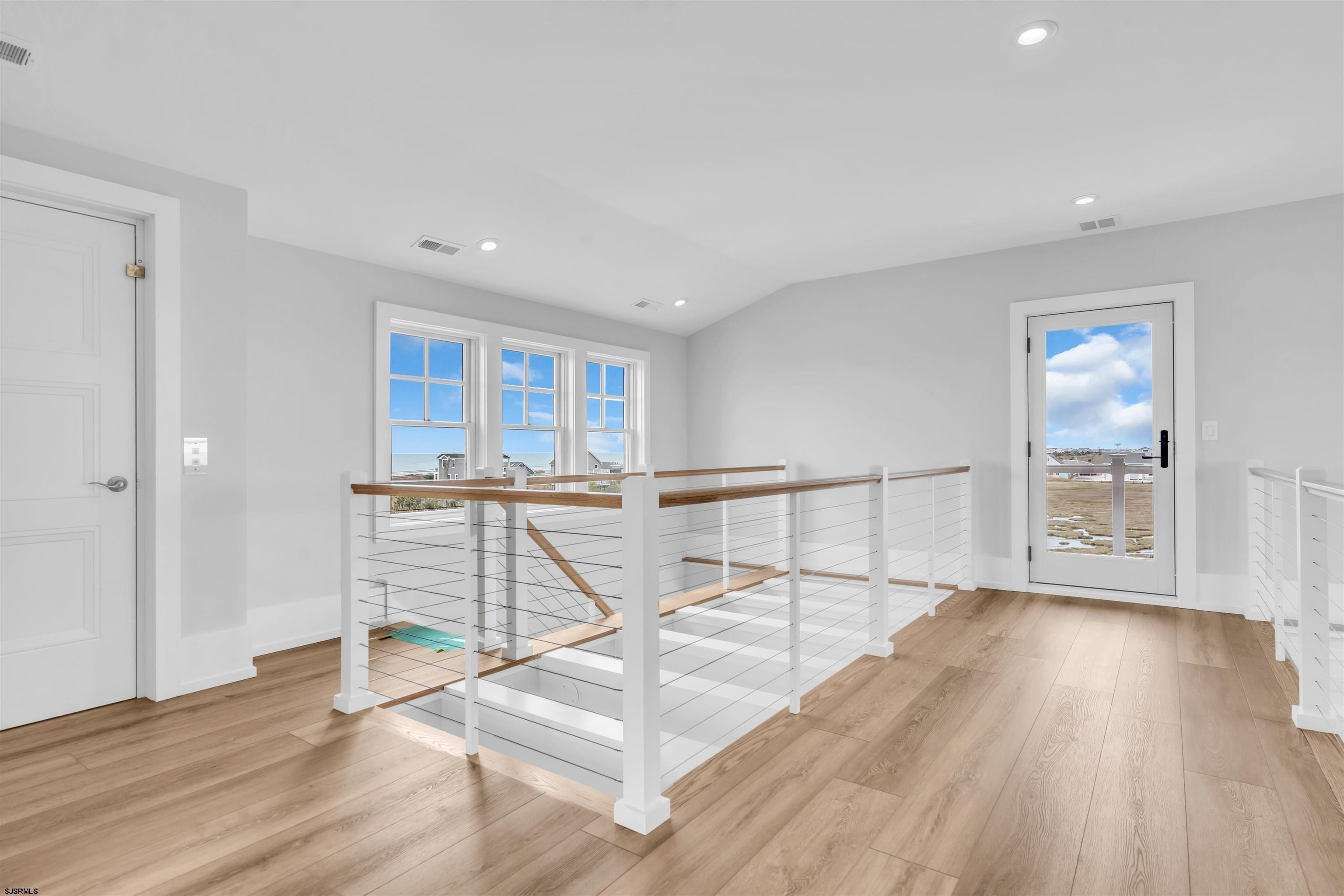 117 Taylor Avenue Strathmere, NJ 08248 - Photo 49 of 70 a view of an empty room with wooden floor