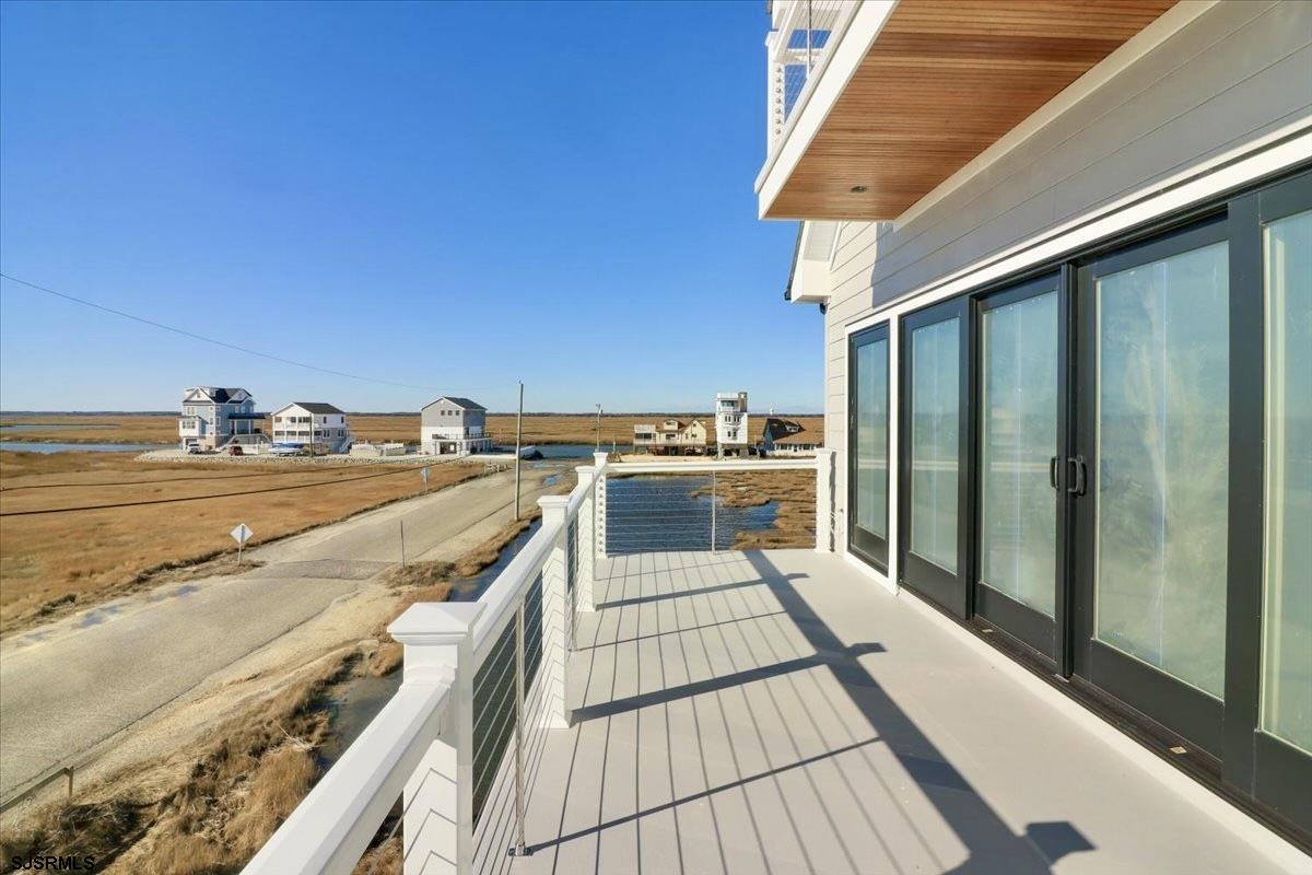 117 Taylor Avenue Strathmere, NJ 08248 - Photo 59 of 70 a view of a balcony with wooden floor