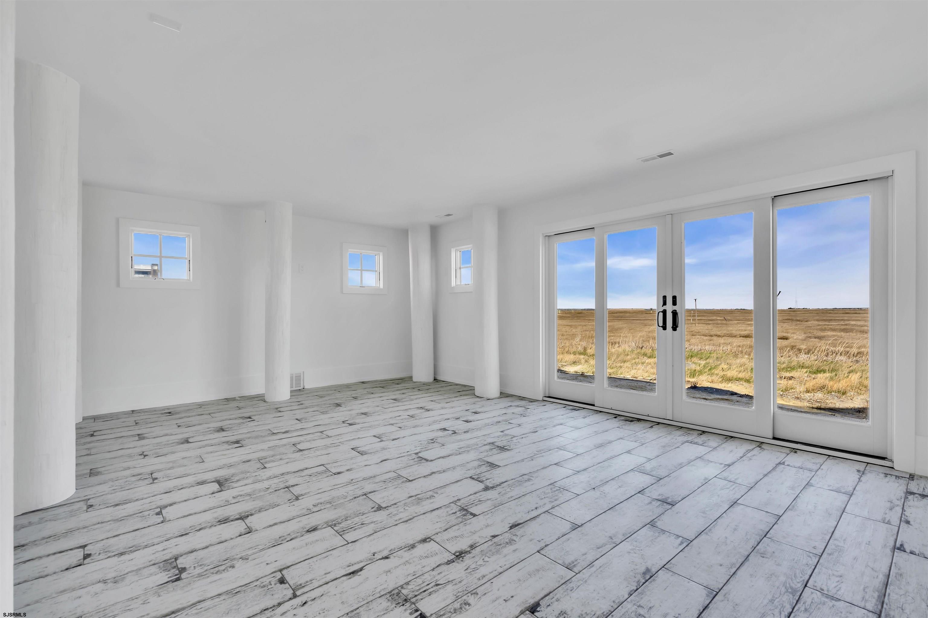 117 Taylor Avenue Strathmere, NJ 08248 - Photo 6 of 70 a view of an empty room with a window