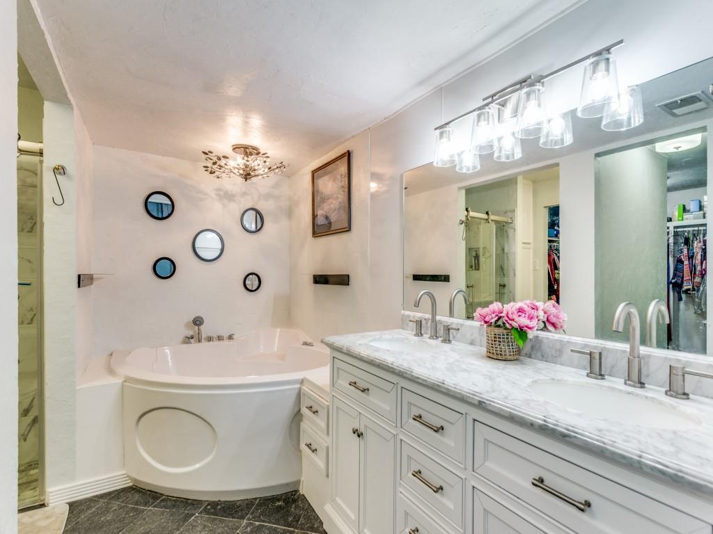 405 Chandler Lake Road Fort Worth, TX 76103 - Photo 11 of 20 a bathroom with a sink double vanity and a mirror
