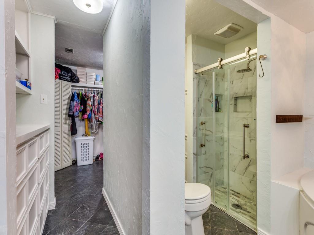 405 Chandler Lake Road Fort Worth, TX 76103 - Photo 12 of 20 a bathroom with a toilet and a shower