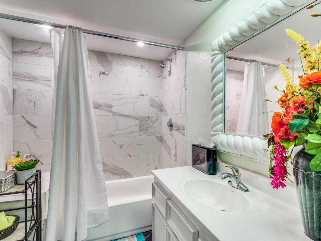 405 Chandler Lake Road Fort Worth, TX 76103 - Photo 14 of 20 a bathroom with a sink toilet and shower