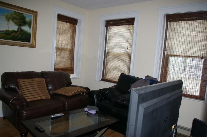12 Ransom Road, Unit 6 Boston, MA 02135 - Photo 10 of 16 a living room with furniture and a window
