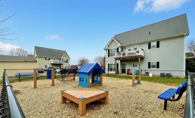 a view of a house with swimming pool and sitting area