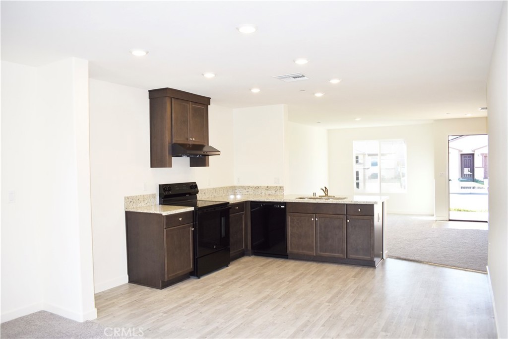 334 Arpent Court Merced, CA 95341 - Photo 2 of 10 a kitchen with stainless steel appliances granite countertop a sink and cabinets
