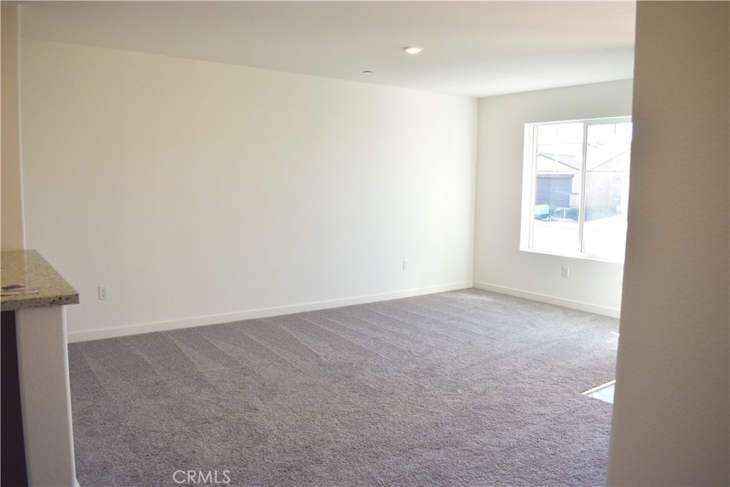 334 Arpent Court Merced, CA 95341 - Photo 4 of 10 an empty room with a window
