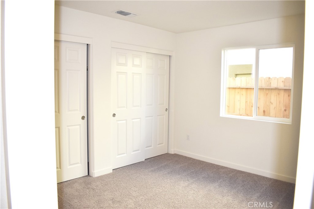 334 Arpent Court Merced, CA 95341 - Photo 6 of 10 a view of an empty room with a window