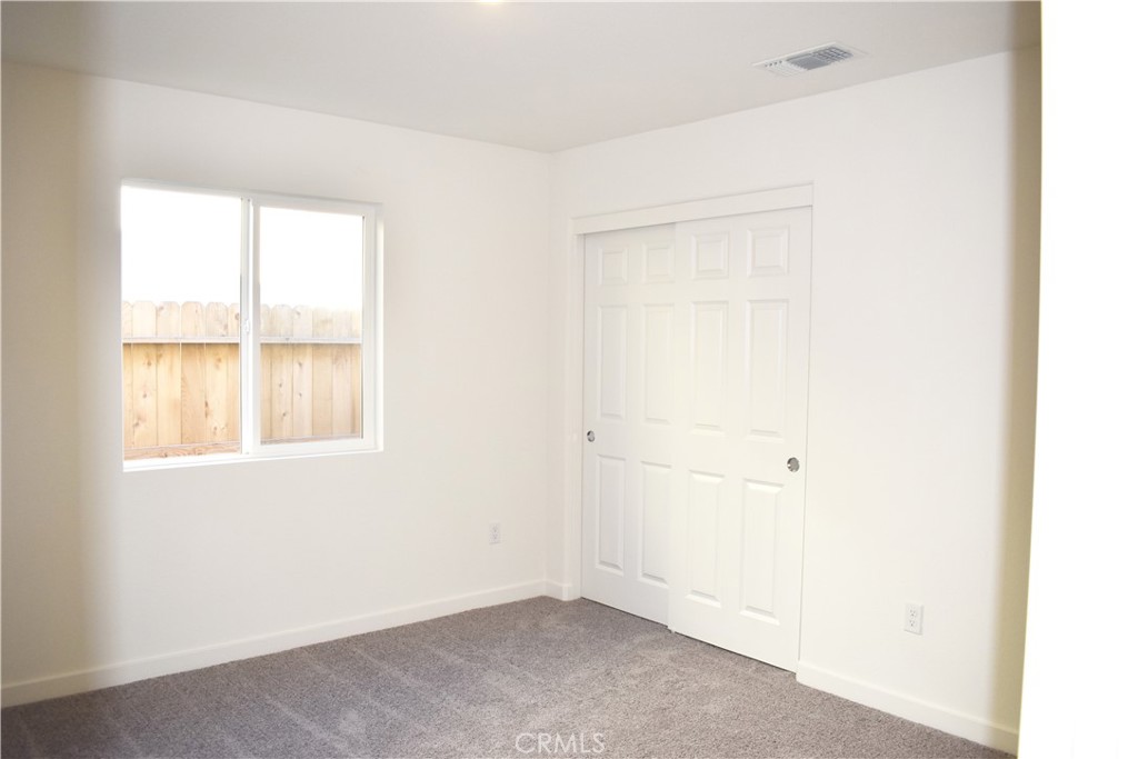 334 Arpent Court Merced, CA 95341 - Photo 7 of 10 an empty room with a window