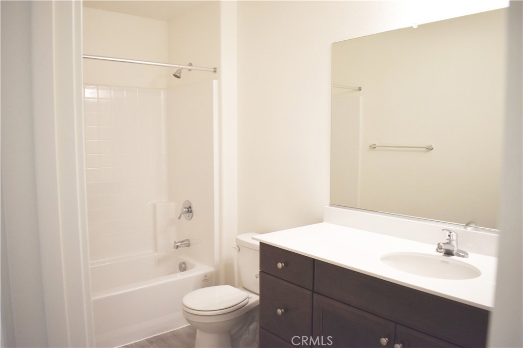 334 Arpent Court Merced, CA 95341 - Photo 10 of 10 a bathroom with a sink a toilet and shower