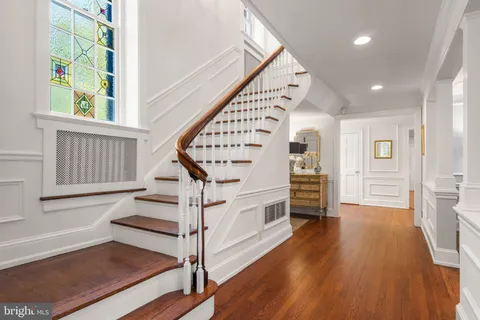a view of entryway with wooden floor and stairs