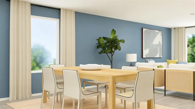 a dining room with furniture and window