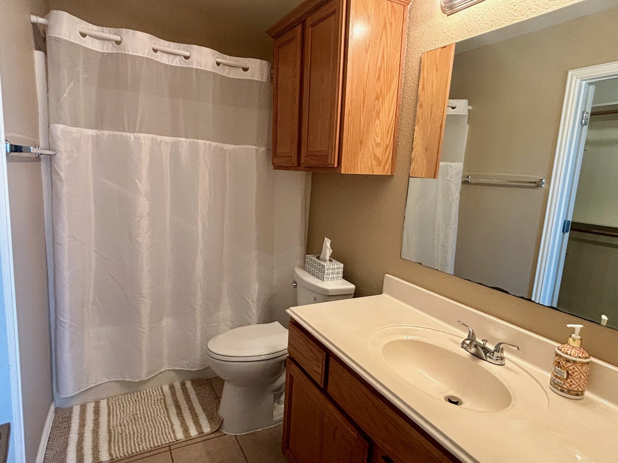 1001 Krenek Tap Road, Unit 2801 College Station, TX 77840 - Photo 8 of 12 a bathroom with a sink toilet and shower