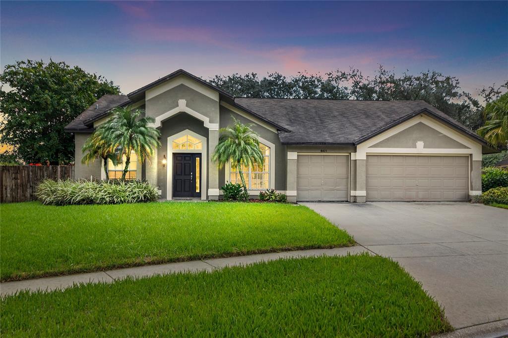 8421 Ridgebrook Circle Odessa, FL 33556 - Photo 1 of 1 a front view of a house with a garden