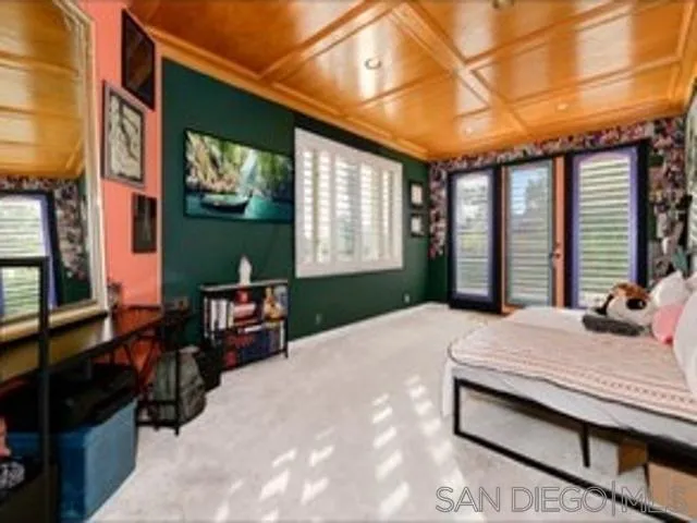 17381 Circa Oriente Rancho Santa Fe, CA 92067 - Photo 13 of 37 a bedroom with a bed and a large window