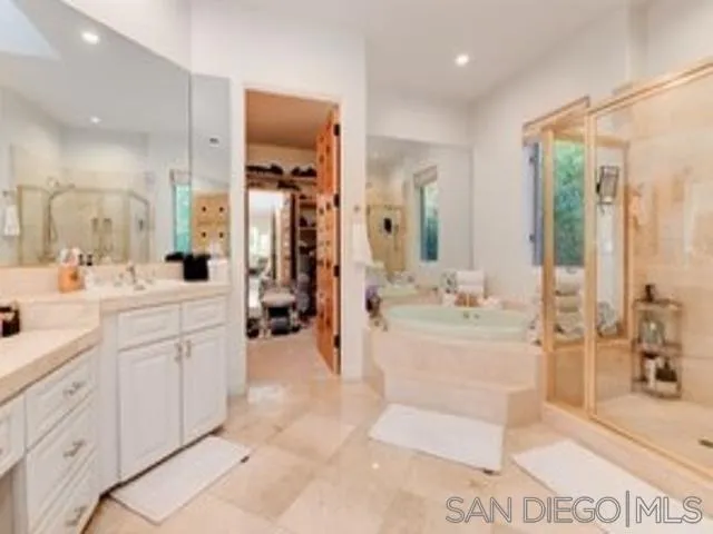 17381 Circa Oriente Rancho Santa Fe, CA 92067 - Photo 20 of 37 a bathroom with a double vanity sink mirror and shower