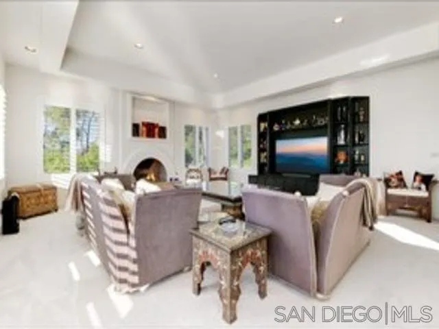 17381 Circa Oriente Rancho Santa Fe, CA 92067 - Photo 4 of 37 a living room with furniture and a flat screen tv