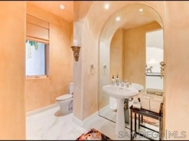 17381 Circa Oriente Rancho Santa Fe, CA 92067 - Photo 9 of 37 a bathroom with a sink toilet and a mirror