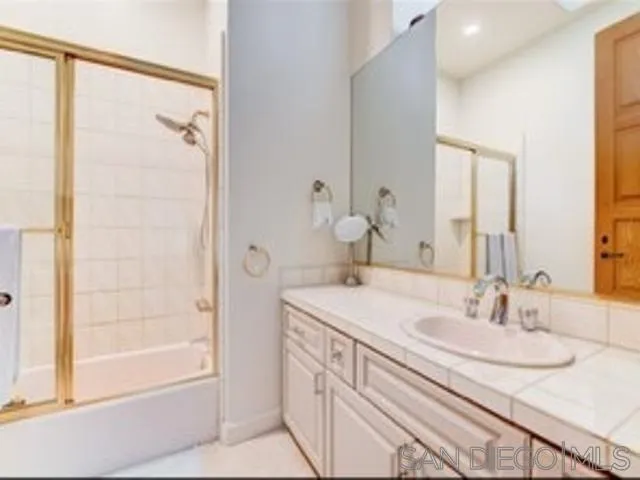 17381 Circa Oriente Rancho Santa Fe, CA 92067 - Photo 10 of 37 a bathroom with a sink and a mirror