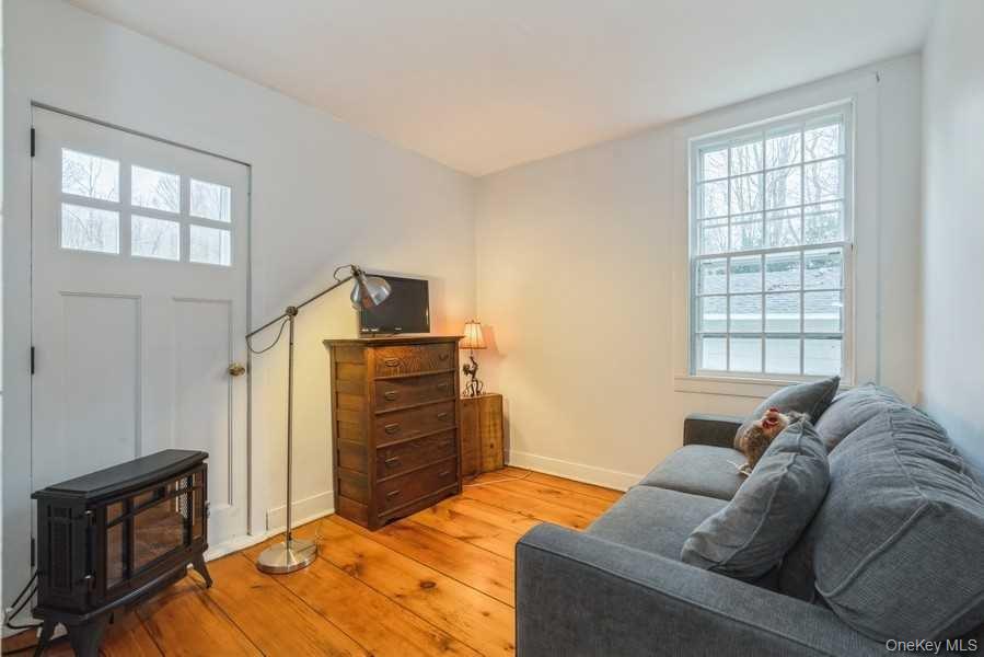 1141 Beekman Road Hopewell Junction, NY 12533 - Photo 18 of 36 a bedroom with a bed and wooden floor