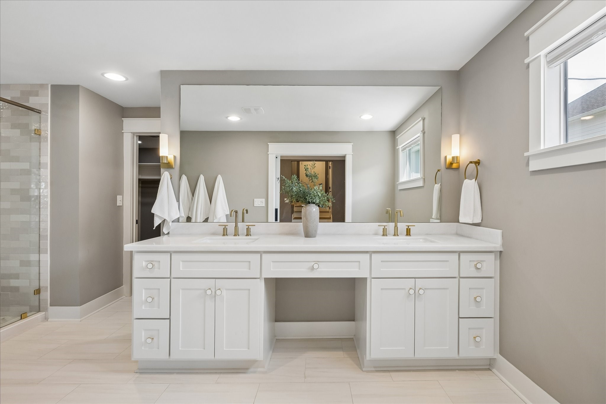 1112 Merrill Street Houston, TX 77009 - Photo 3 of 42 Entering into the primary en-suite is the double sink vanity with ample drawer and cabinet storage.