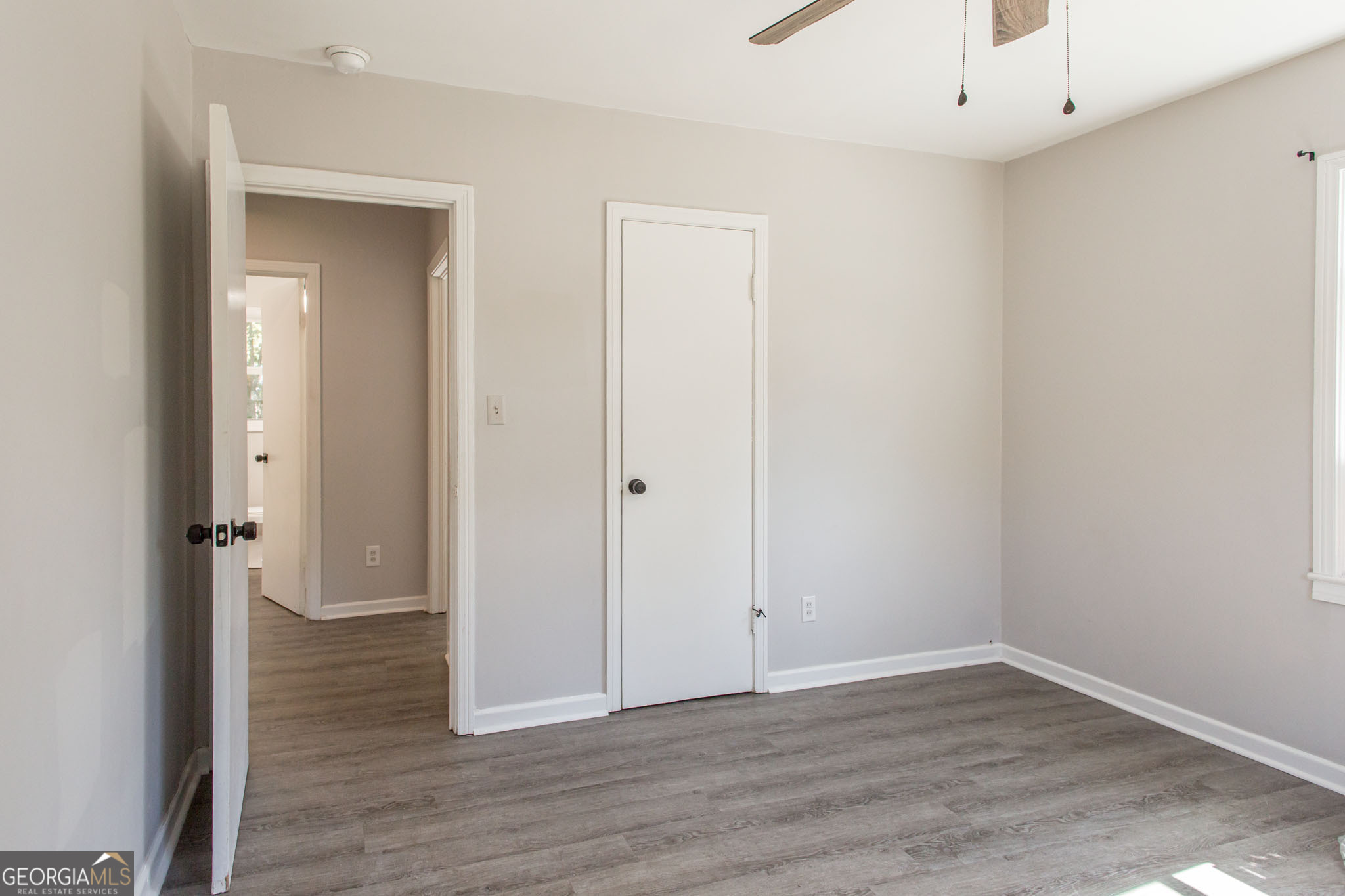 2312 Spurgeon Street Waycross, GA 31501 - Photo 15 of 20 an empty room with wooden floor and closet