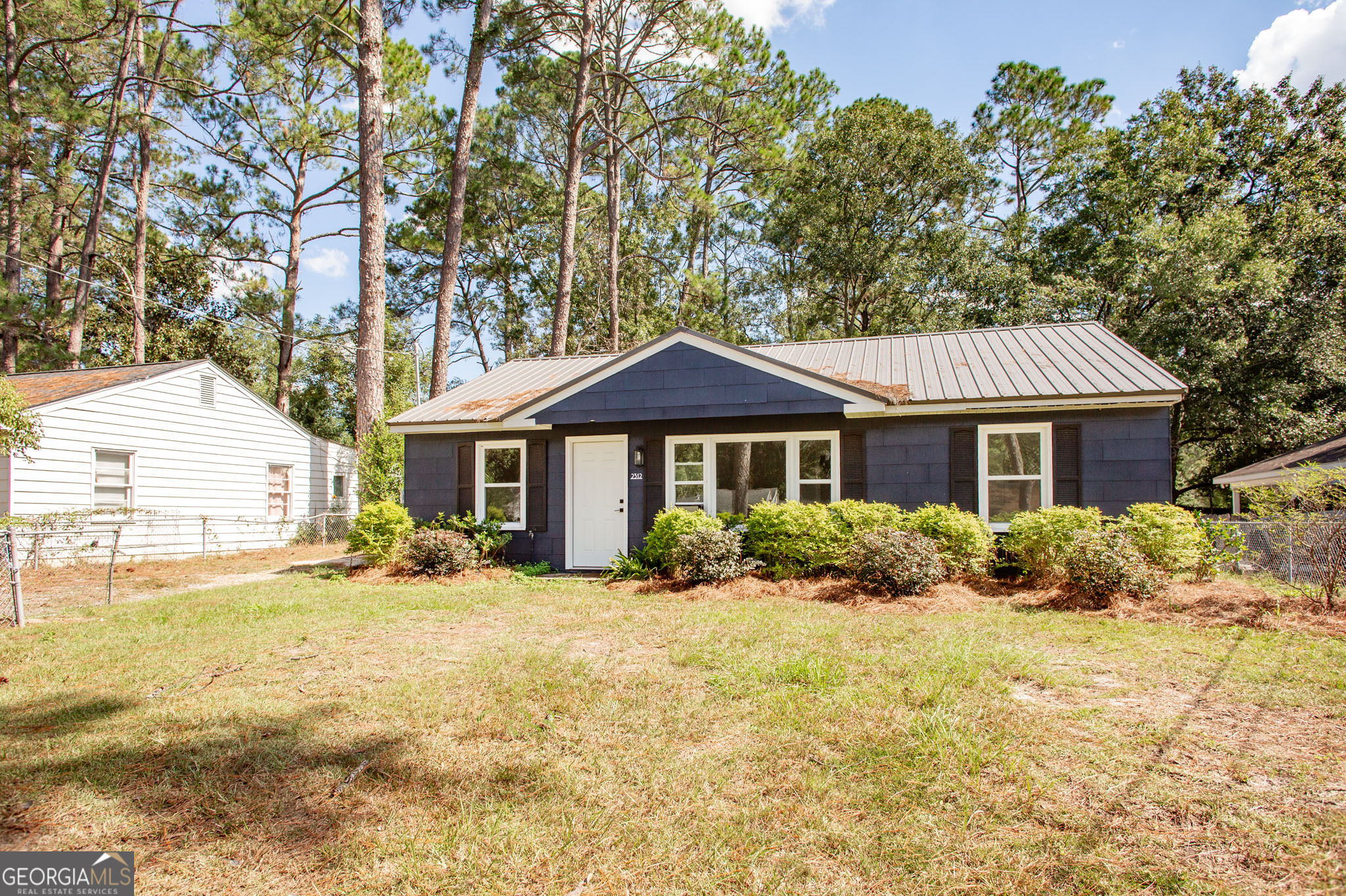 2312 Spurgeon Street Waycross, GA 31501 - Photo 2 of 20 a front view of a house with a yard