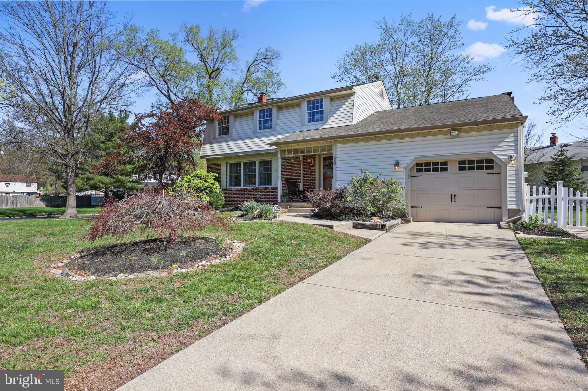 30 Millbridge Road Clementon, NJ 08021 - Photo 2 of 2 a front view of a house with a yard and trees