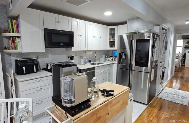 a living room with fireplace furniture and a flat screen tv