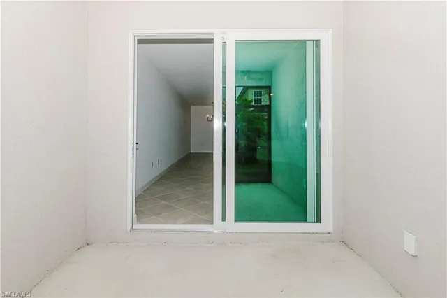 an empty room with mirror