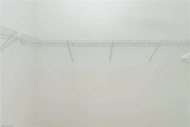 a view of a room with racks on the wall