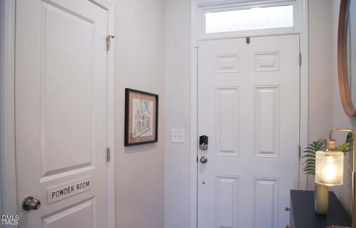 5006 Tura Street Raleigh, NC 27610 - Photo 5 of 32 a view of a hallway with front door