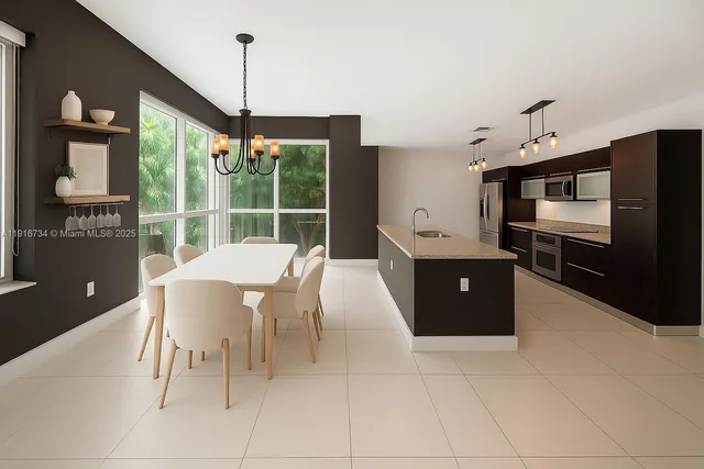 a dining room with furniture and window