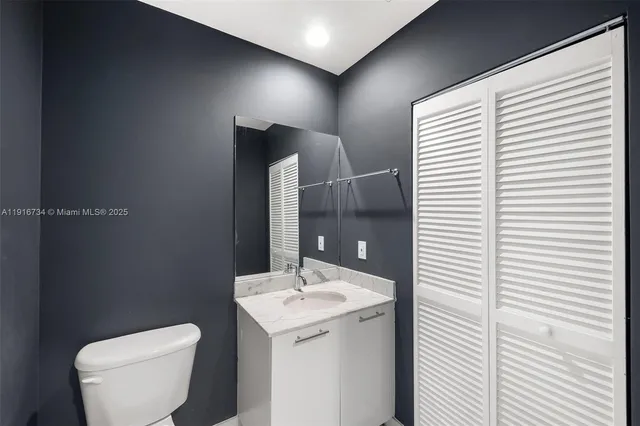 a bathroom with a toilet and a sink