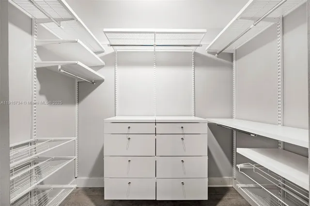 a view of an empty walk in closet