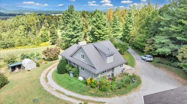 a kitchen with stainless steel appliances granite countertop a refrigerator a sink and a stove