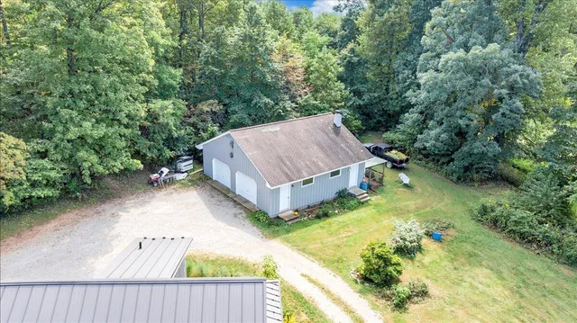 a kitchen with granite countertop white cabinets and stainless steel appliances