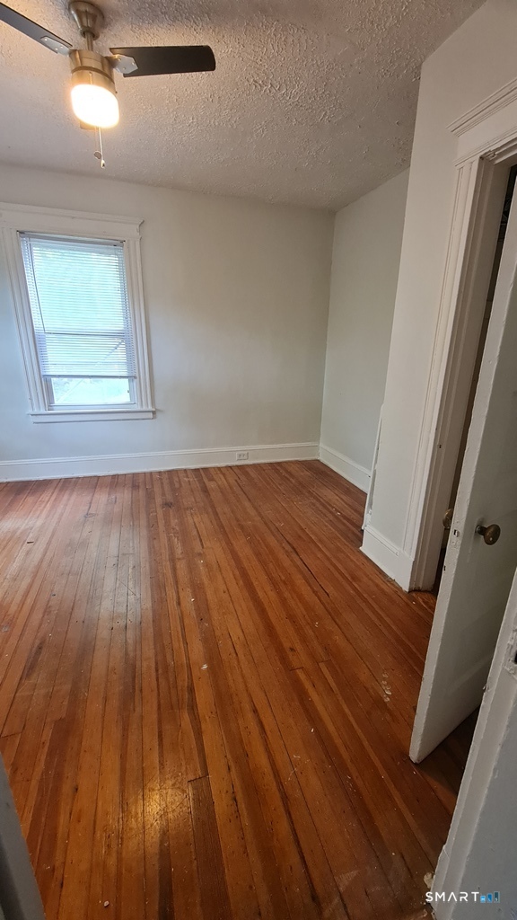 64-66 Ridge Street Manchester, CT 06040 - Photo 11 of 21 wooden floor in an empty room