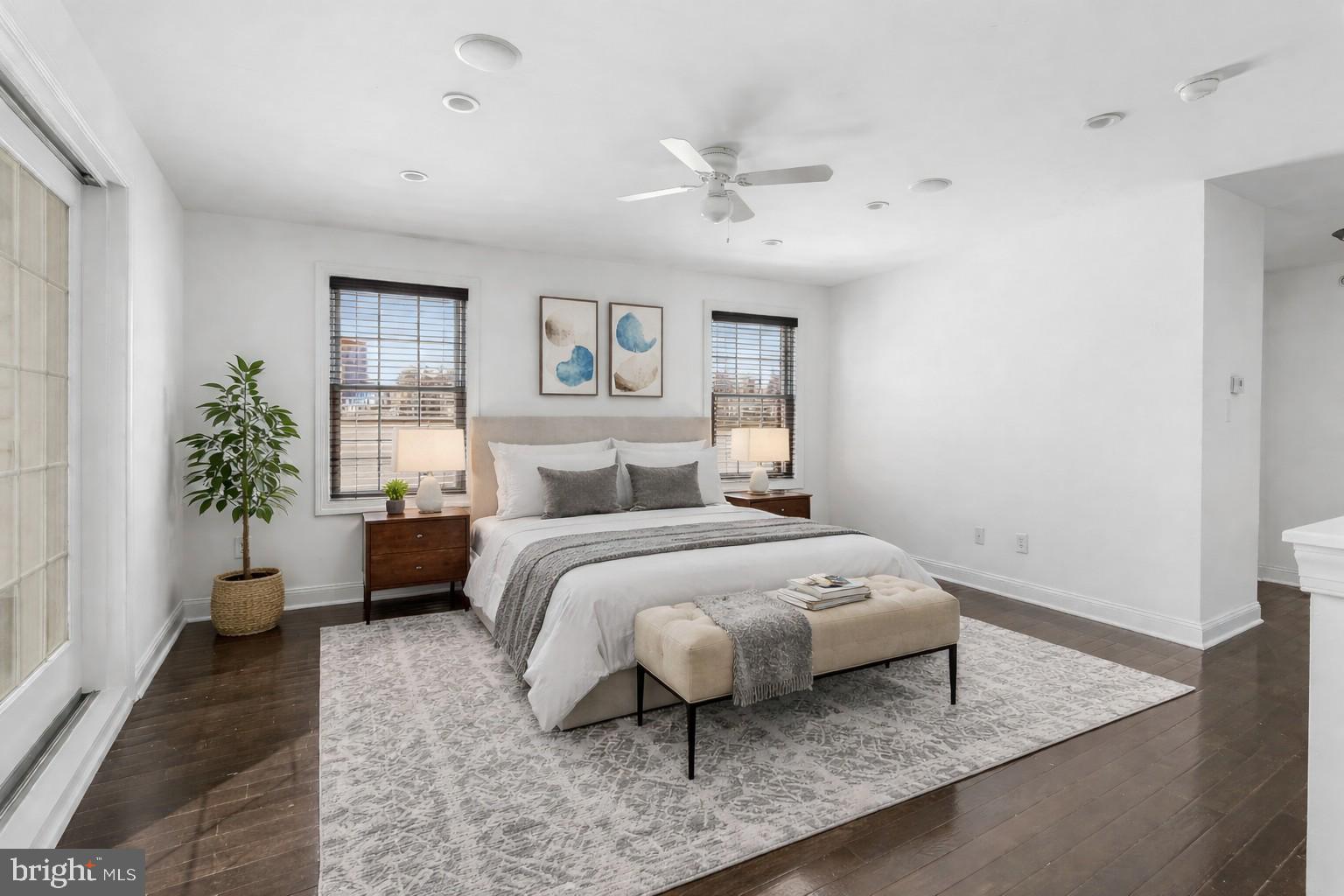 1015 North 3rd Street, Unit H Philadelphia, PA 19123 - Photo 12 of 27 a bedroom with a bed and a potted plant