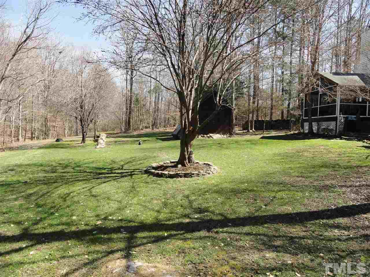 3520 Ribcowski Court Raleigh, NC 27616 - Photo 23 of 25 a view of a backyard with large trees