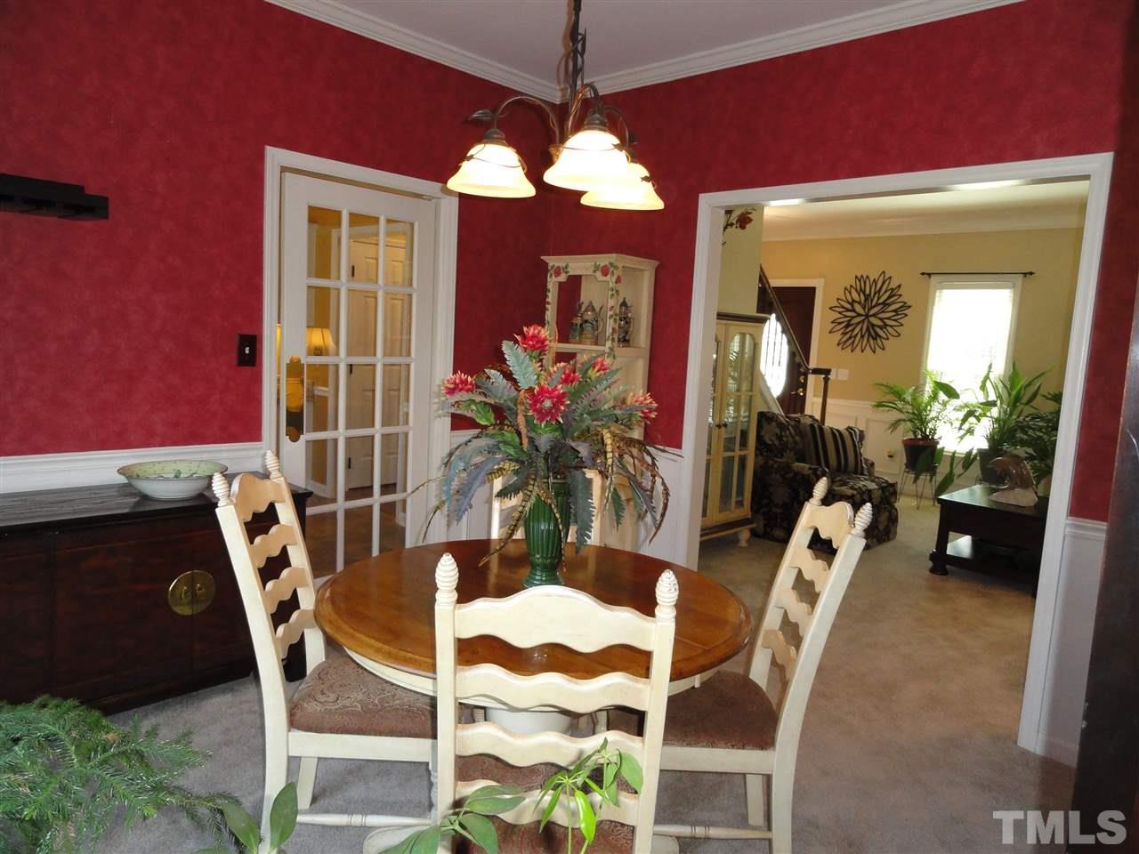 3520 Ribcowski Court Raleigh, NC 27616 - Photo 6 of 25 a view of a dining room with furniture and wooden floor